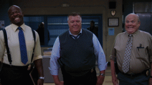 Terry, Scully, and Hitchcock forcing smiles